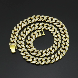 Detail of 12mm gold Cuban link chain with paved rhinestones and secure clasp closure