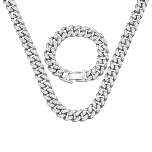 Macro detail of iced out 12mm Cuban link chain and bracelet with square rhinestone buckle