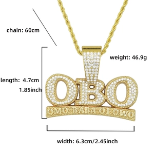 Detailed view of iced out OBO pendant with dimensions 6.3cm x 4.7cm on a gold rope chain