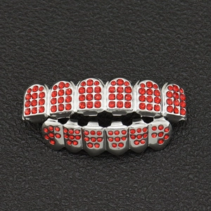 Hip hop style silver teeth grillz set featuring vibrant red rhinestones on black background