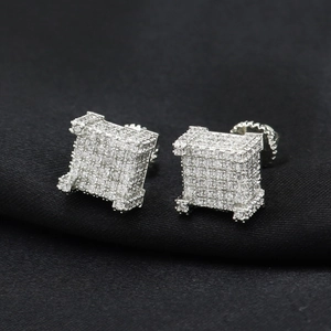 Close-up of square iced out stud earrings with pave setting and screw back details