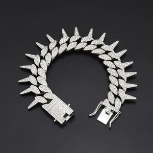 Iced out silver Cuban chain bracelet with spikes and sparkling rhinestones for men