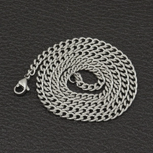 Macro detail of 3mm stainless steel Cuban link chain with secure lobster clasp