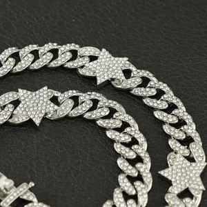 Iced out silver Cuban chain necklace with star pendants and rhinestones in hip hop style