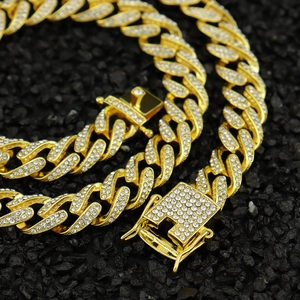 Iced out gold Cuban link chain necklace with sparkling crystals and rectangle clasp
