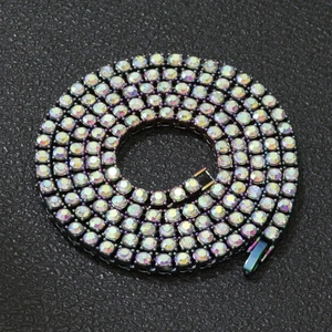 Macro detail of dark metal tennis chain with colorful AB rhinestones and secure clasp