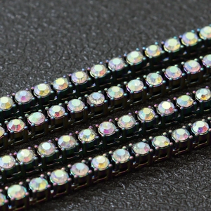 Icy rainbow rhinestone tennis chain with dark gunmetal plating and four-prong setting