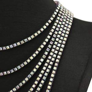 Detail view of multi-layer rainbow crystal tennis chain with iridescent rhinestones