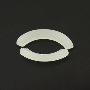 Macro view of two translucent silicone fixing waxes for hip-hop braces on black surface