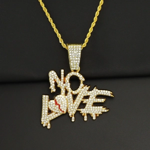 Detailed close-up of iced-out NO LOVE pendant with heart-broken design on golden rope chain
