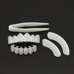Iced out silver hip hop teeth grillz set with clear zircons and application tools