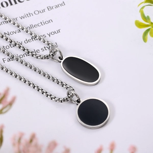Minimalist stainless steel necklace set with black enamel round and oval pendants