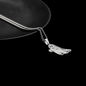 Cartoon ghost pendant necklace in silver stainless steel on a black display base