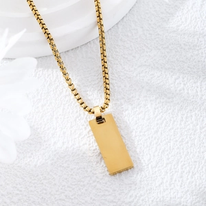 Minimalist gold rectangular pendant necklace with a sleek box chain on a clean white base