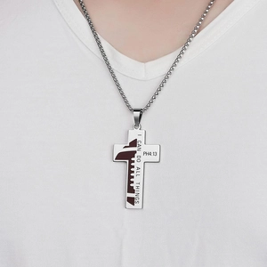 Stainless steel soccer cross necklace with Philippians 4:13 verse on white t-shirt