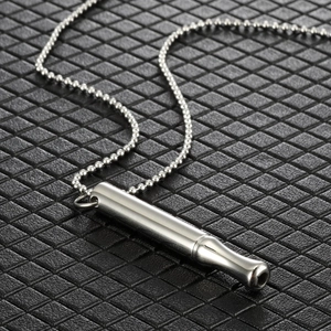 Polished silver stainless steel meditation whistle pendant on a ball chain necklace