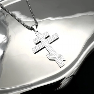 Detail showing an Orthodox double cross pendant on a stainless steel round box chain