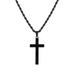 Macro shot of minimalist black stainless steel cross pendant and rope chain details