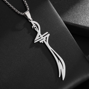 Detailed macro view of silver Zulfiqar sword pendant on textured black leather