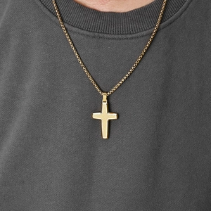 Men's gold stainless steel cross necklace with mesh texture worn on a grey shirt
