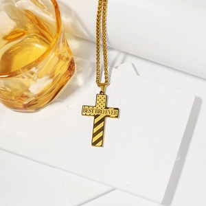 Detail of gold stainless steel cross necklace with BEST BRO EVER American flag engraving