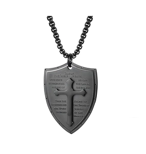 Detail view of black stainless steel shield pendant with engraved cross and bible verse