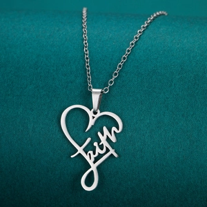 Polished silver stainless steel faith cross necklace on dark green textured background