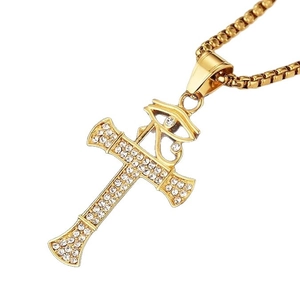 Collier croix en acier inoxydable doré avec œil d'Horus et cristaux blancs