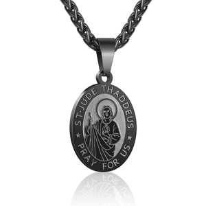 Macro detail of black stainless steel St. Jude Thaddeus religious pendant necklace