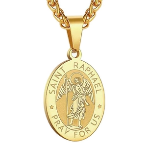 Macro view of gold Saint Raphael archangel pendant with intricate religious engraving