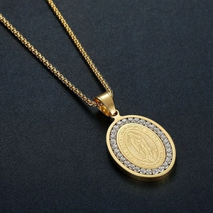 Iced out Virgin Mary oval pendant necklace with cubic zirconia in gold plated finish