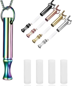 Detail view of colorful meditation whistle pendant with chain and replacement cotton filters