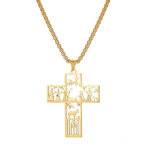 Golden hollowed-out stainless steel cross necklace showing the nativity scene detail