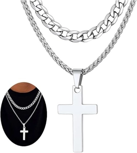 Detailed view of layered silver stainless steel Cuban chain and wheat cross necklace set
