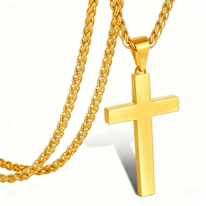Close-up of polished gold cross pendant with heavy wheat chain on white background