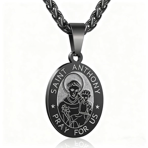 Black oval Saint Anthony pendant necklace with thick wheat chain on white background