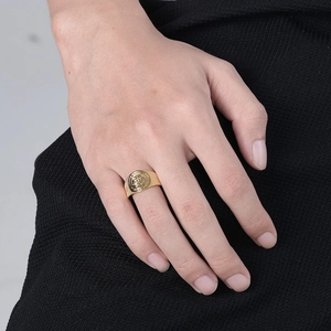 Adjustable golden stainless steel Exorcist Jesus signet ring shown on male hand