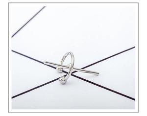 Detail view of silver C-shaped cross ear cuff with geometric bar and ball minimalist design
