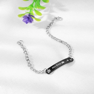 Detail of Her King engraved black plaque on stainless steel chain bracelet with zircon