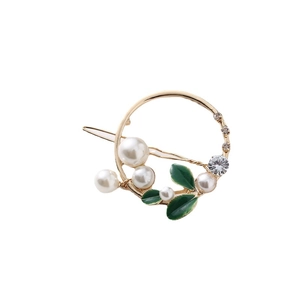 Pince à cheveux ronde dorée avec perles blanches, feuilles d'émail et cristaux