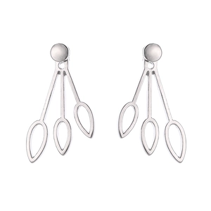 Macro view of silver teardrop stud earrings with hollow leaf jacket back design