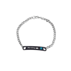 Detailed close-up of His King engraved bracelet with blue crystal and crown charm