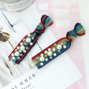 Rainbow glitter hair scrunchies set with faux pearls and silver beads in a knot design
