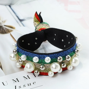 Rainbow striped hair tie with faux pearls and metal beads in a cute bunny ear knot design