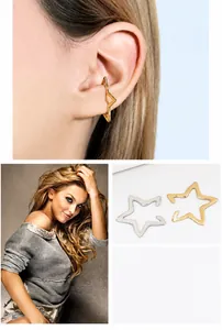 Detail of star-shaped ear cuffs in gold and silver finish with non-piercing design