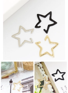 Detailed view of hollow star ear clips in gold, silver, and black finish options