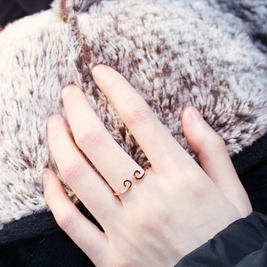 Close-up of rose gold Monkey King crown ring with hollowed filigree cloud design