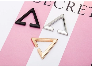 Three-piece set of geometric hollow star ear cuffs in black, silver and gold tones