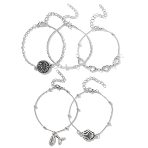 Five-piece silver beach bracelet set featuring shell, cross, and heart charms for women