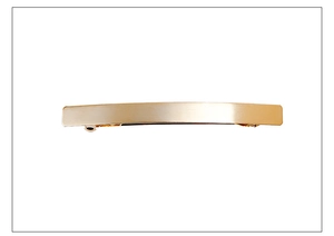 Detail of minimalist rectangular gold spring hair clip with matte frosted metal finish